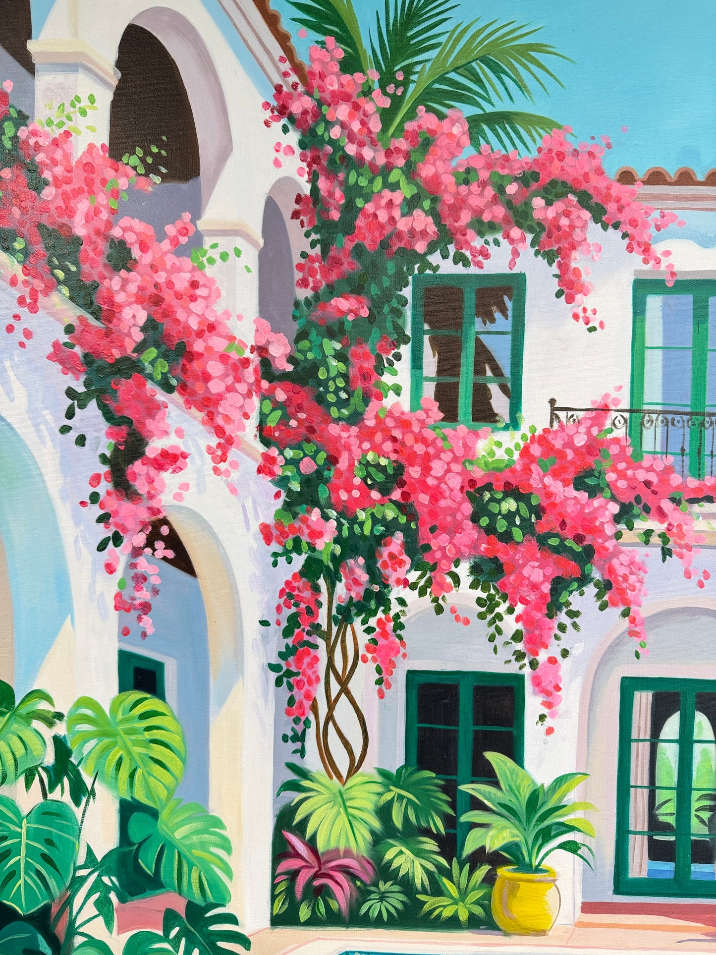 Beneath the bougainvillea balcony
